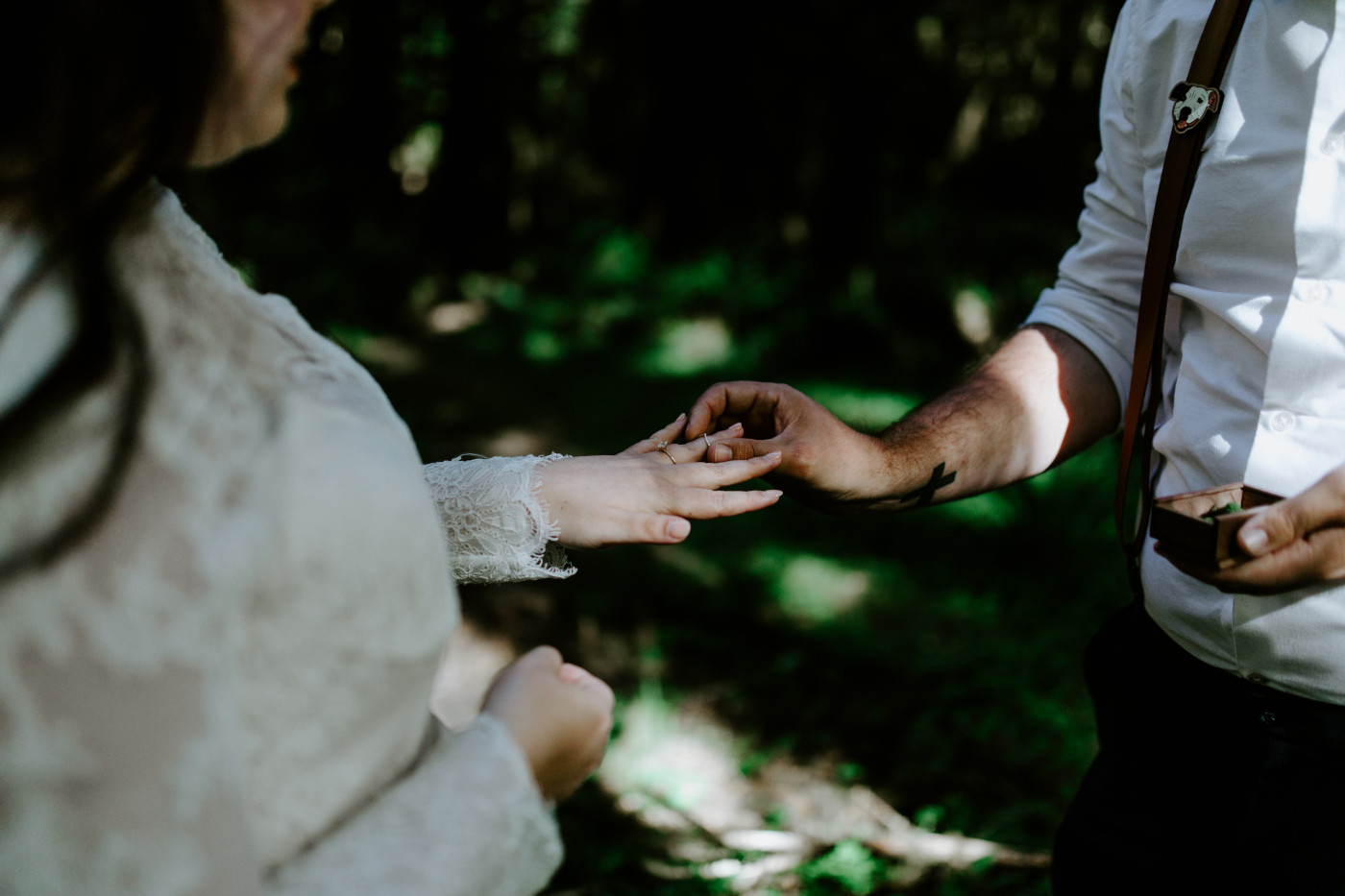 Jack holds a box with the rings. Elopement photography at Olympic National Park by Sienna Plus Josh.