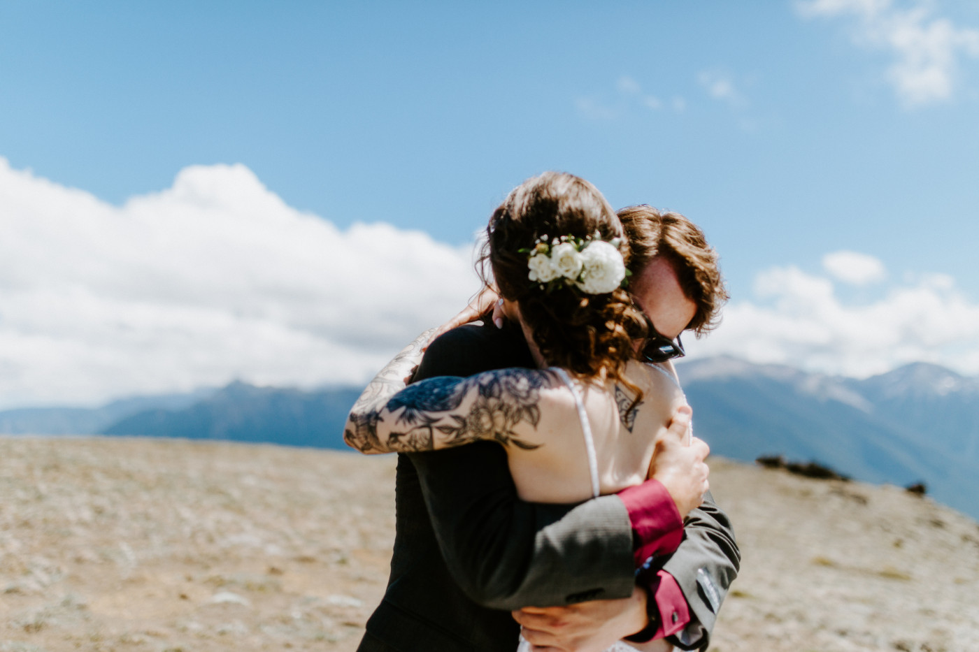 The groom and bride hug at Olympic National Park.
