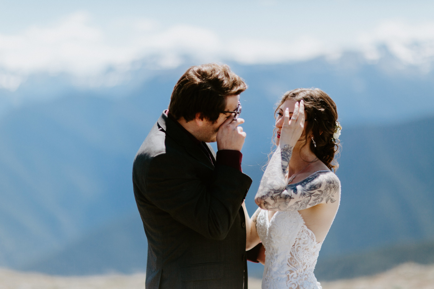 The bride and groom share a moment at Olympic National Park.