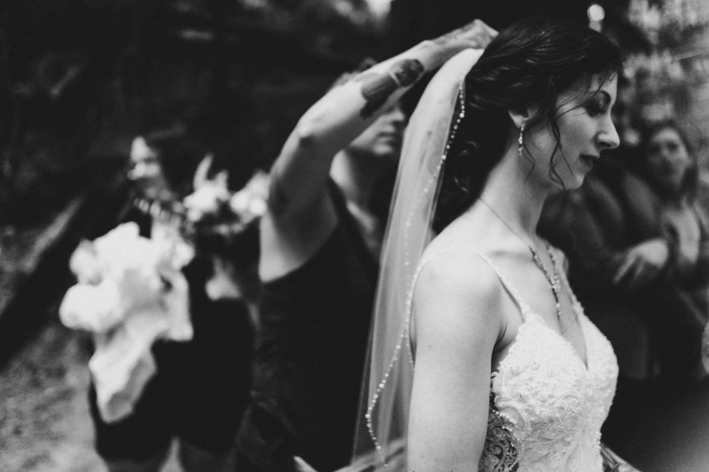 The bride puts on her veil before the elopement at Olympic National Park.