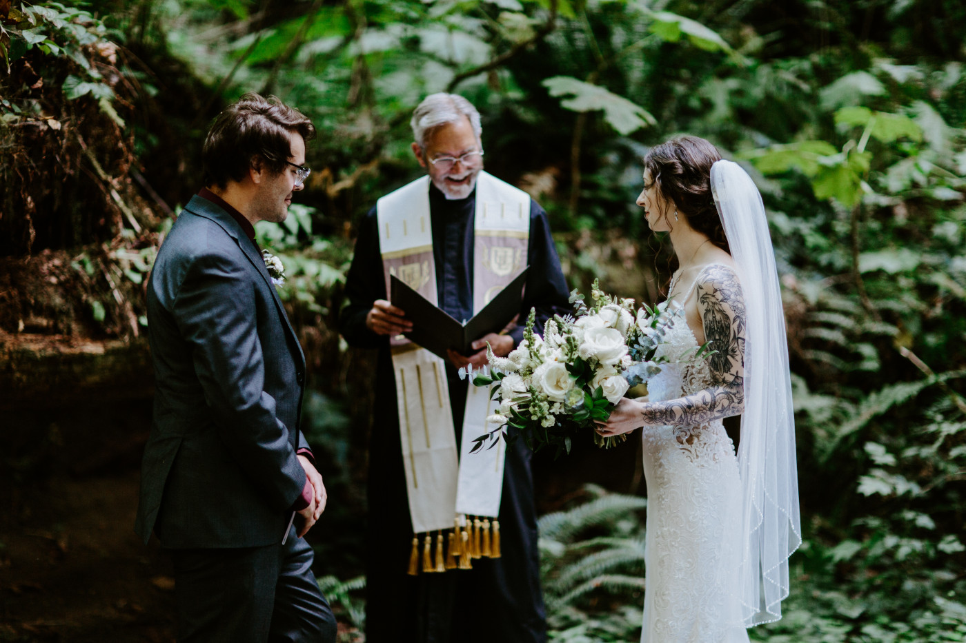 The groom and bride stand together during their elopement ceremony at Olympic National Park.