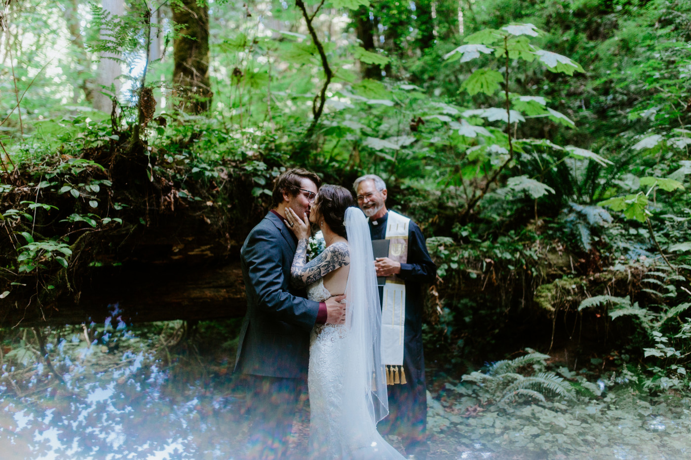 The bride and groom kiss during their elopement ceremony in Olympic National Park.