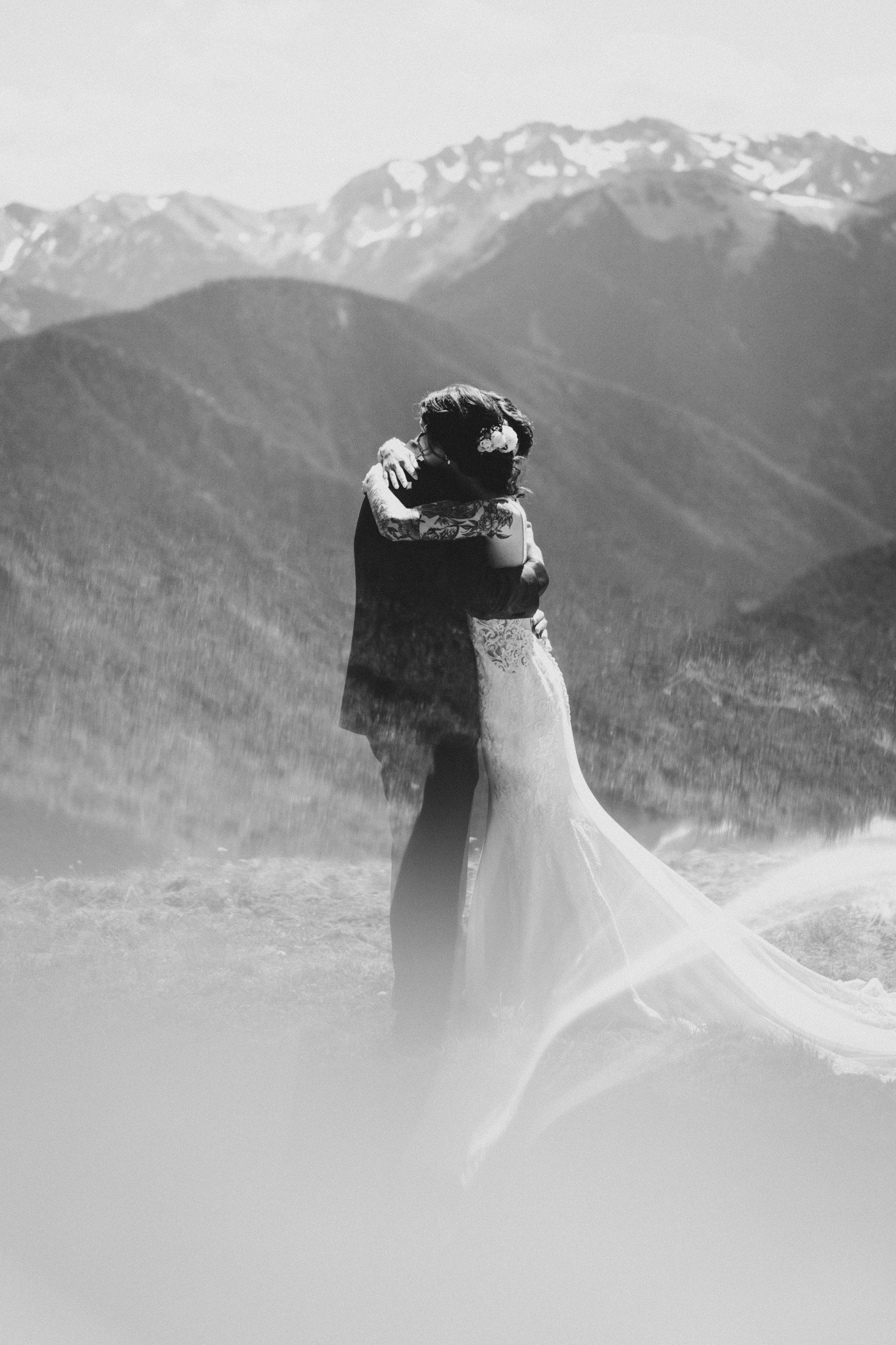 The groom and bride hug each other at Olympic National Park.