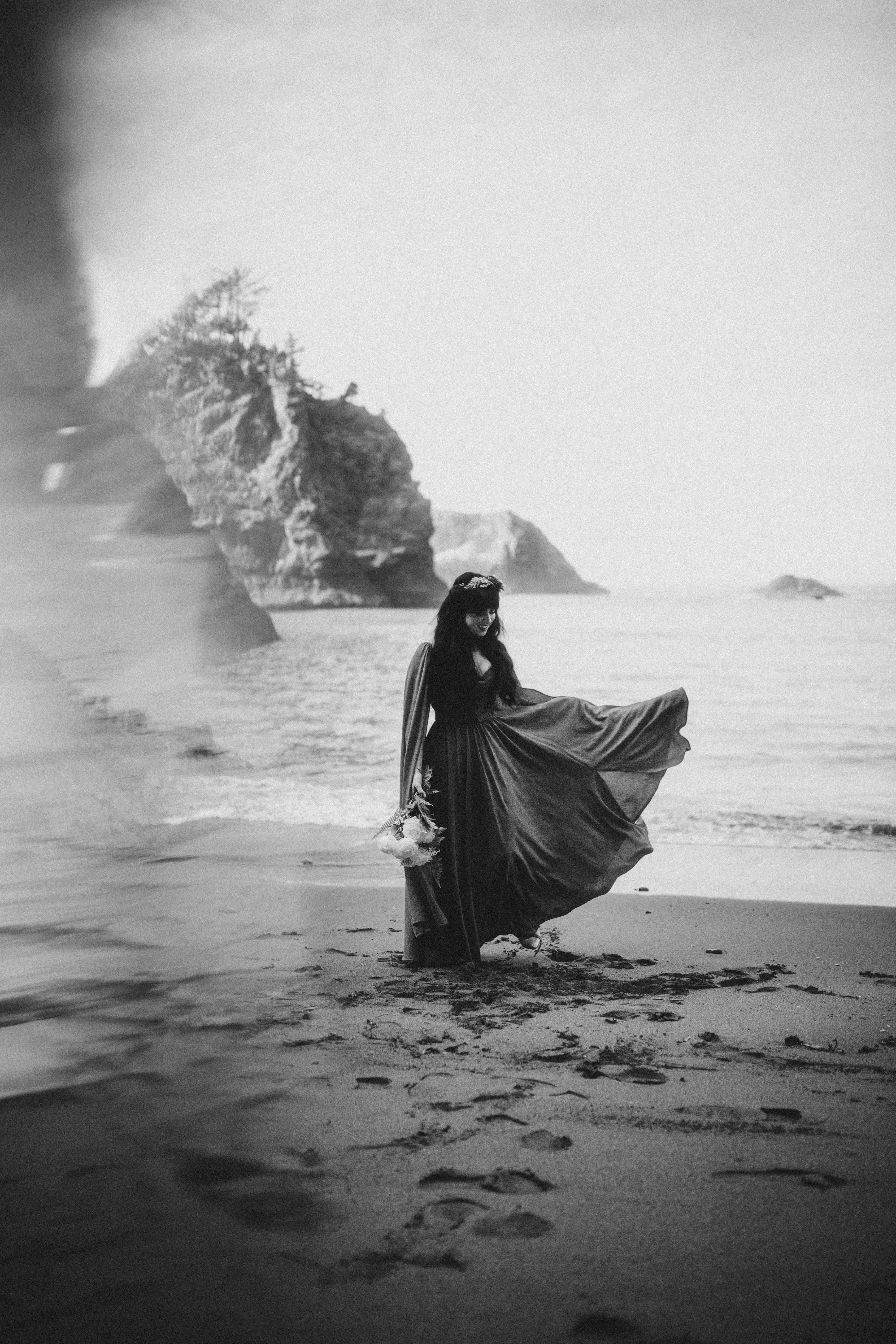 Rachael plays with her wedding dress on the sand at Samuel H. Boardman after her elopement.