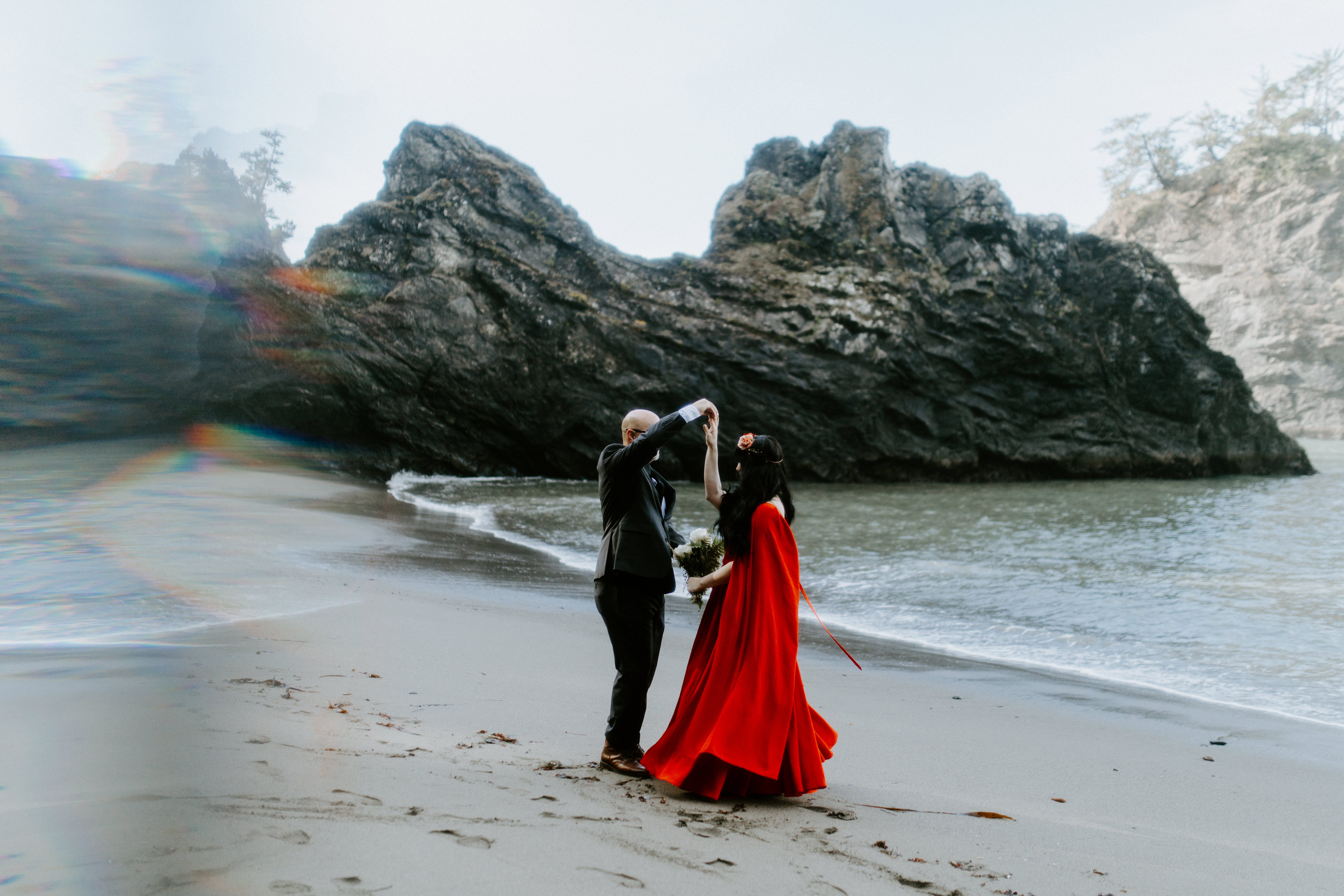 Boyd twirls Rachael on the beach of Samuel H. Boardman after their elopement.