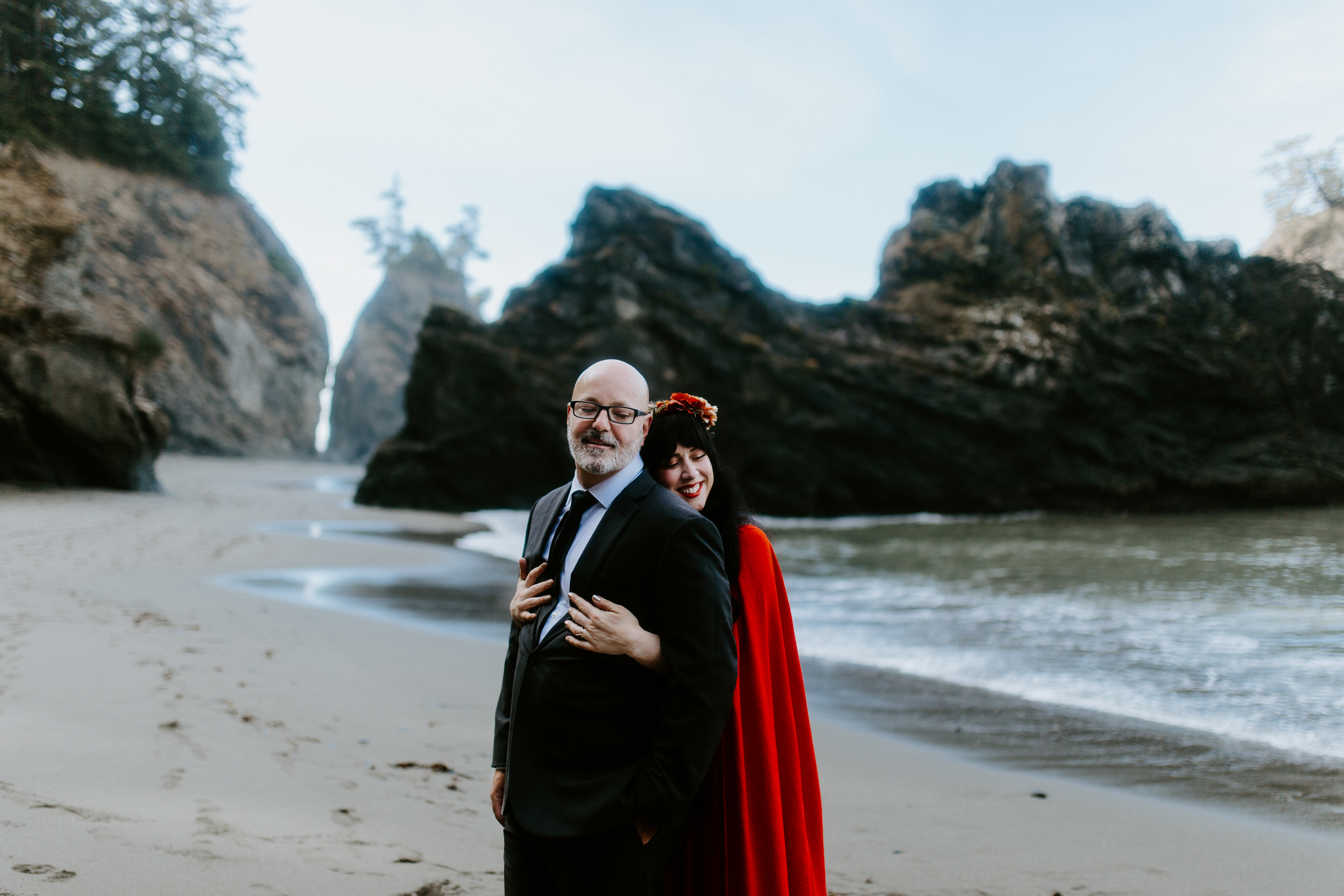 Rachael hugs Boyd on the beach of Samuel H. Boardman after their elopement.