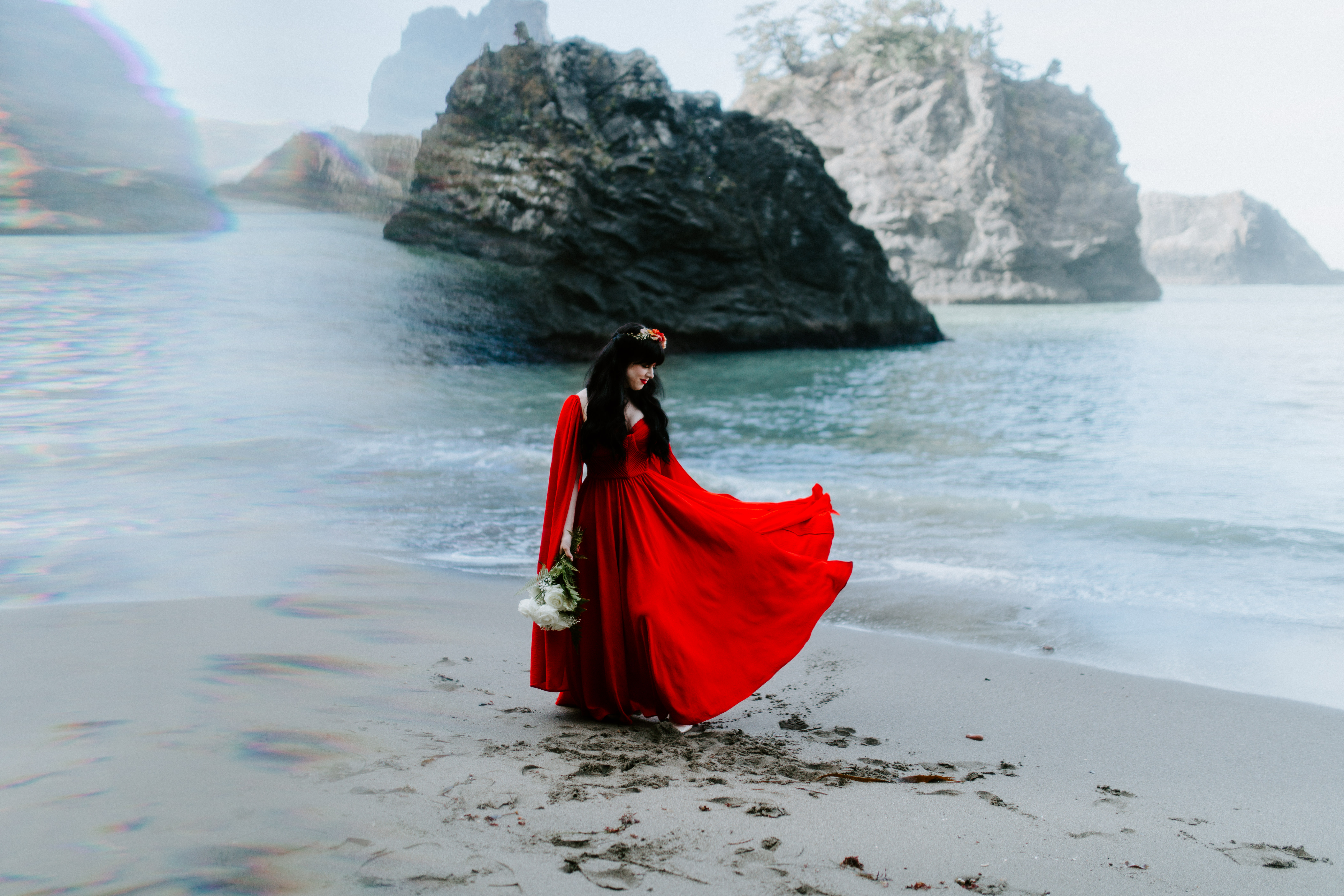 Rachael plays with her dress while standing on the beach of Samuel H. Boardman in Oregon.