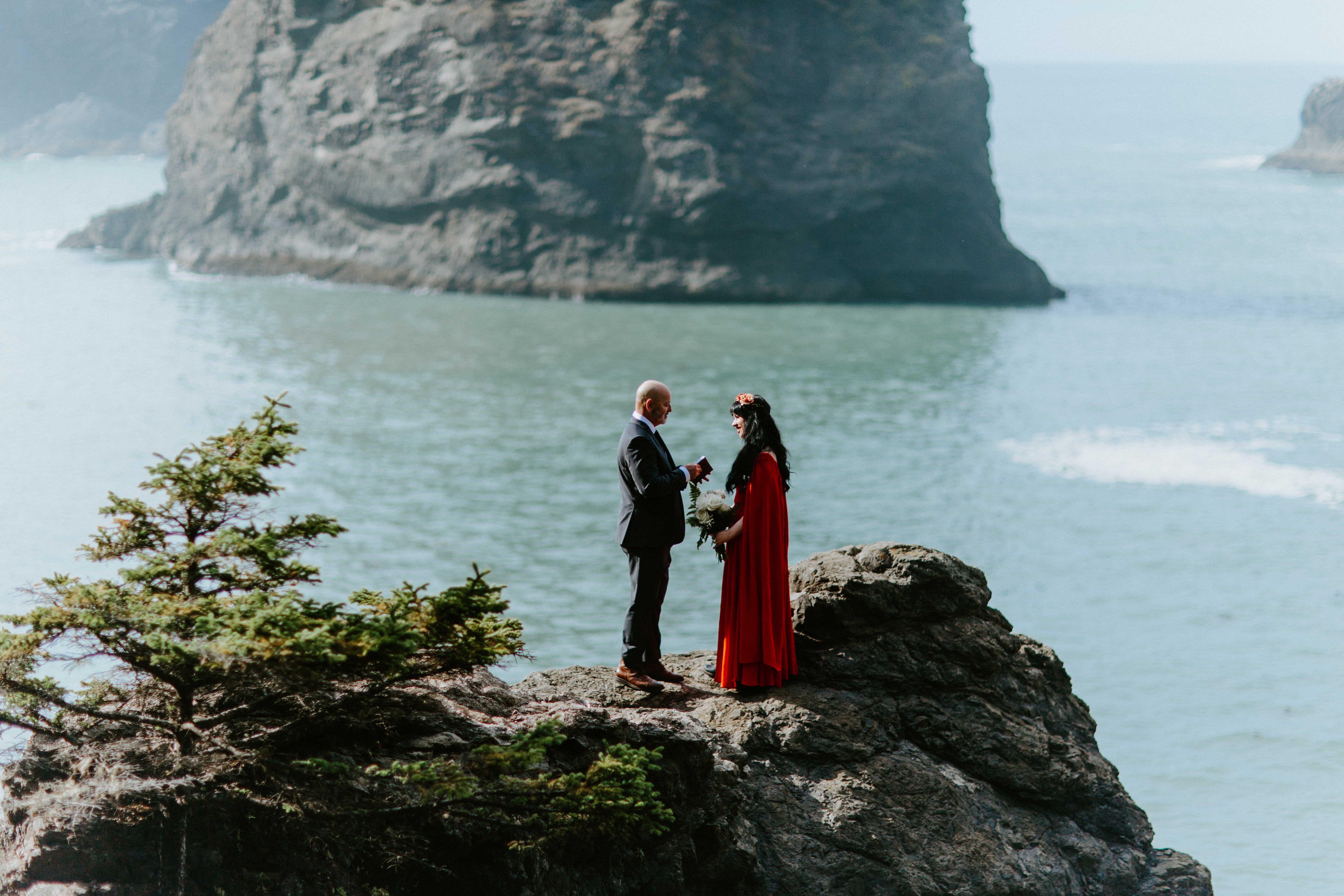 Boyd reads his vows to Rachael on a rock at Samuel H. Boardman, Oregon during their elopement.