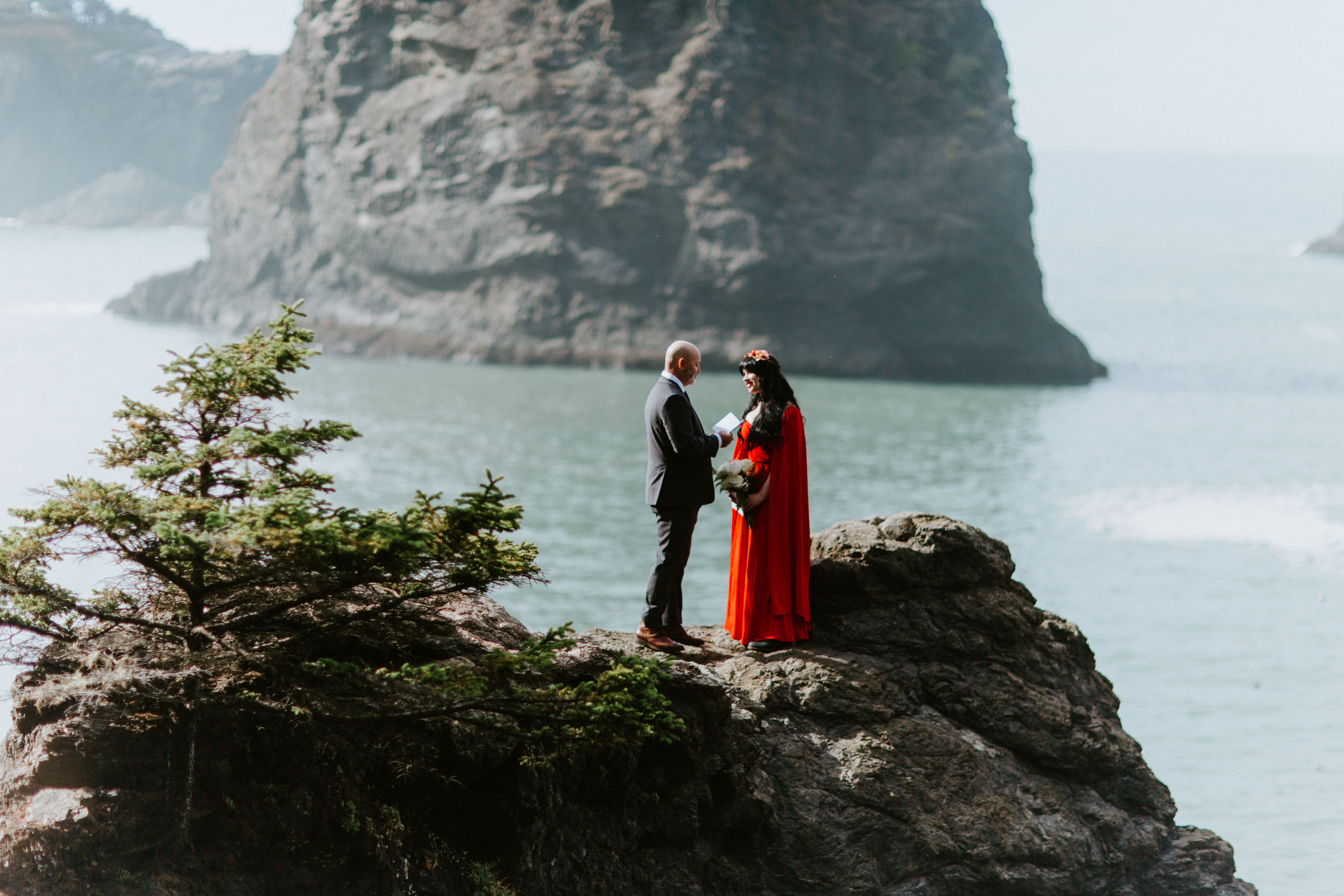 Boyd reads his wedding vows to Rachael on top of a rock at Samuel H. Boardman in Oregon during their elopement ceremony.