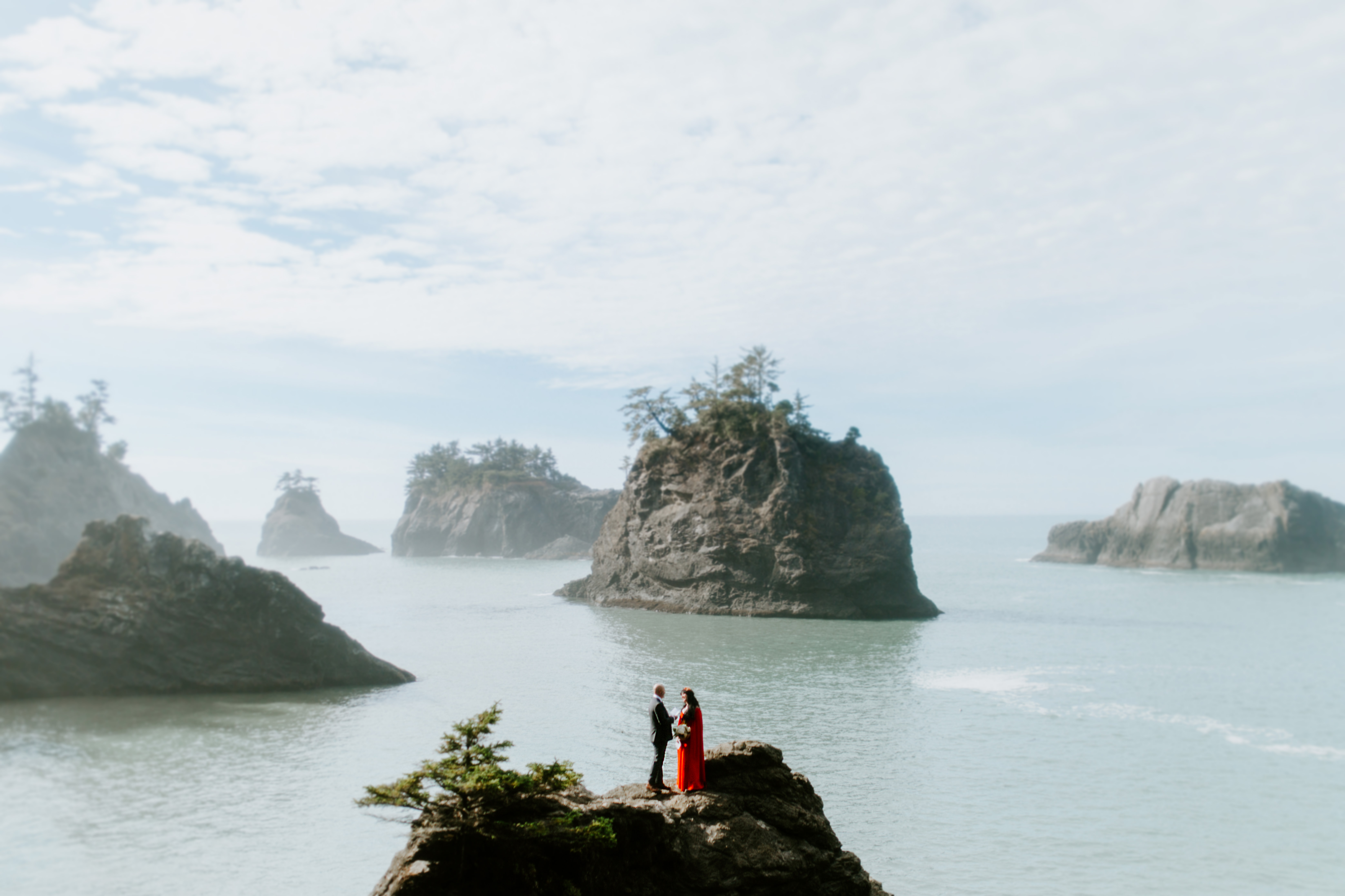 Rachael and Boyd have their wedding ceremony on a rock at Samuel H. Boardman in Oregon.