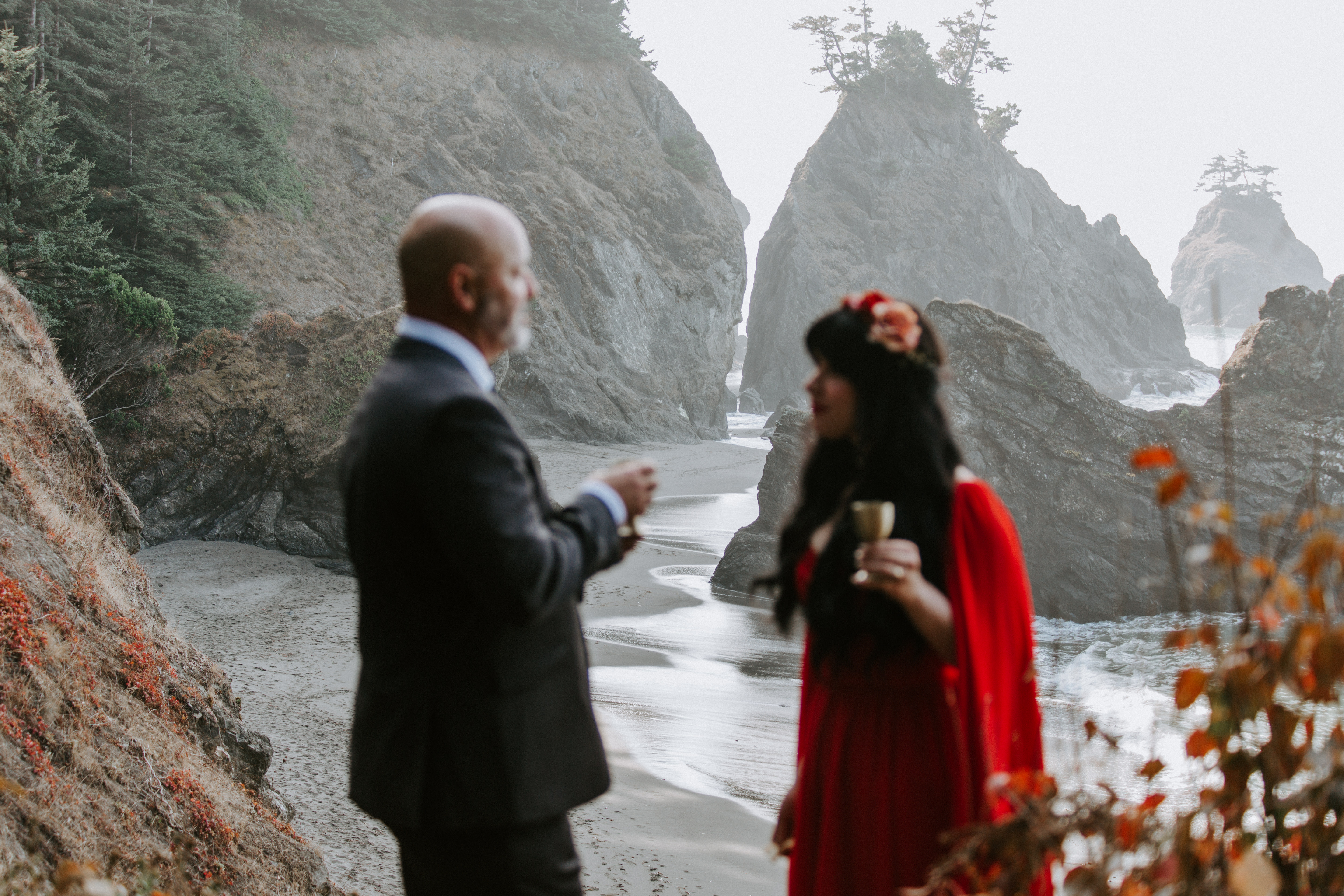 Boyd and Rachael stand together with a view from Samuel H. Boardman, Oregon in the background.