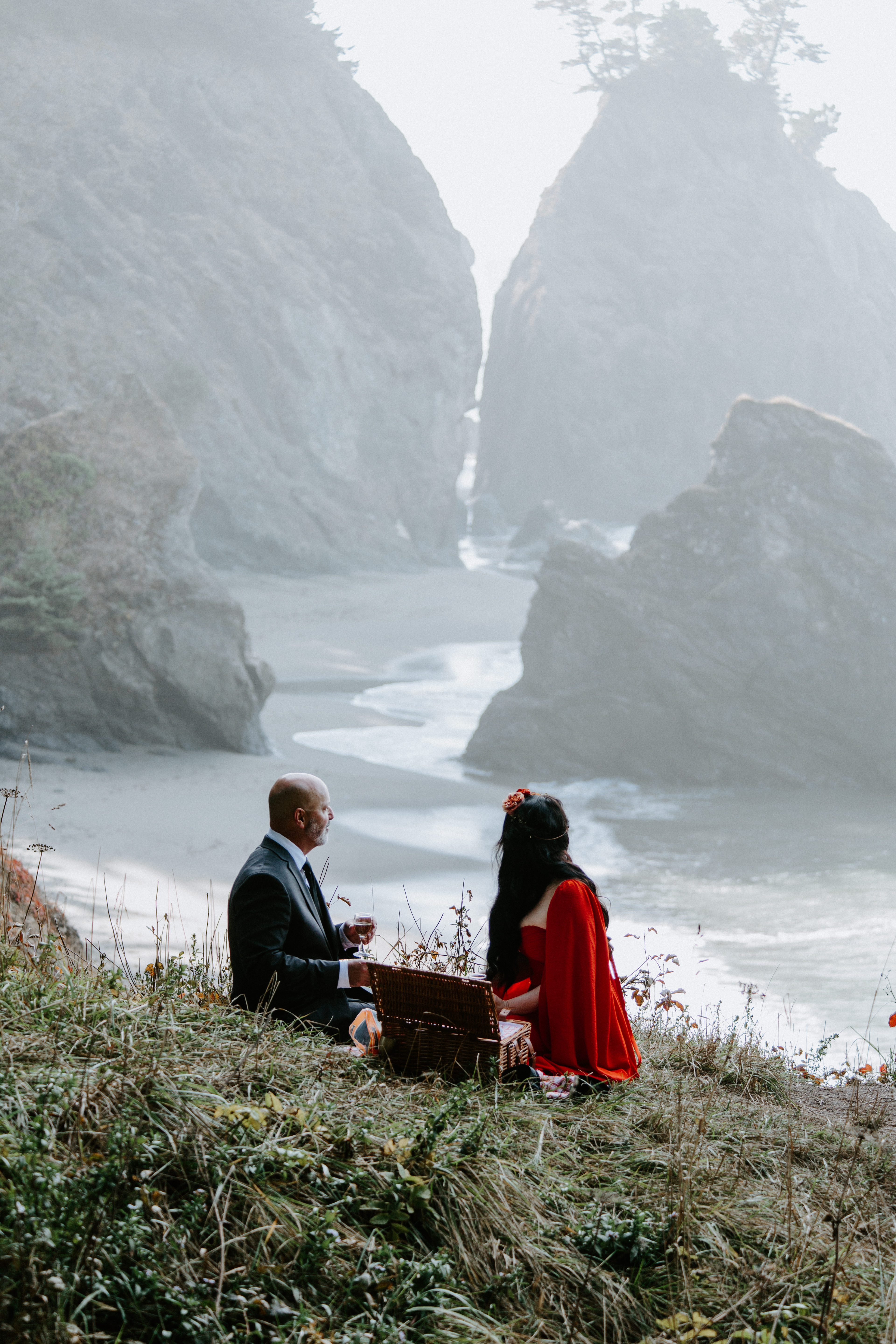 Rachael and Boyd enjoy the view from their picnic spot after their elopement in Samuel H. Boardman, Oregon.