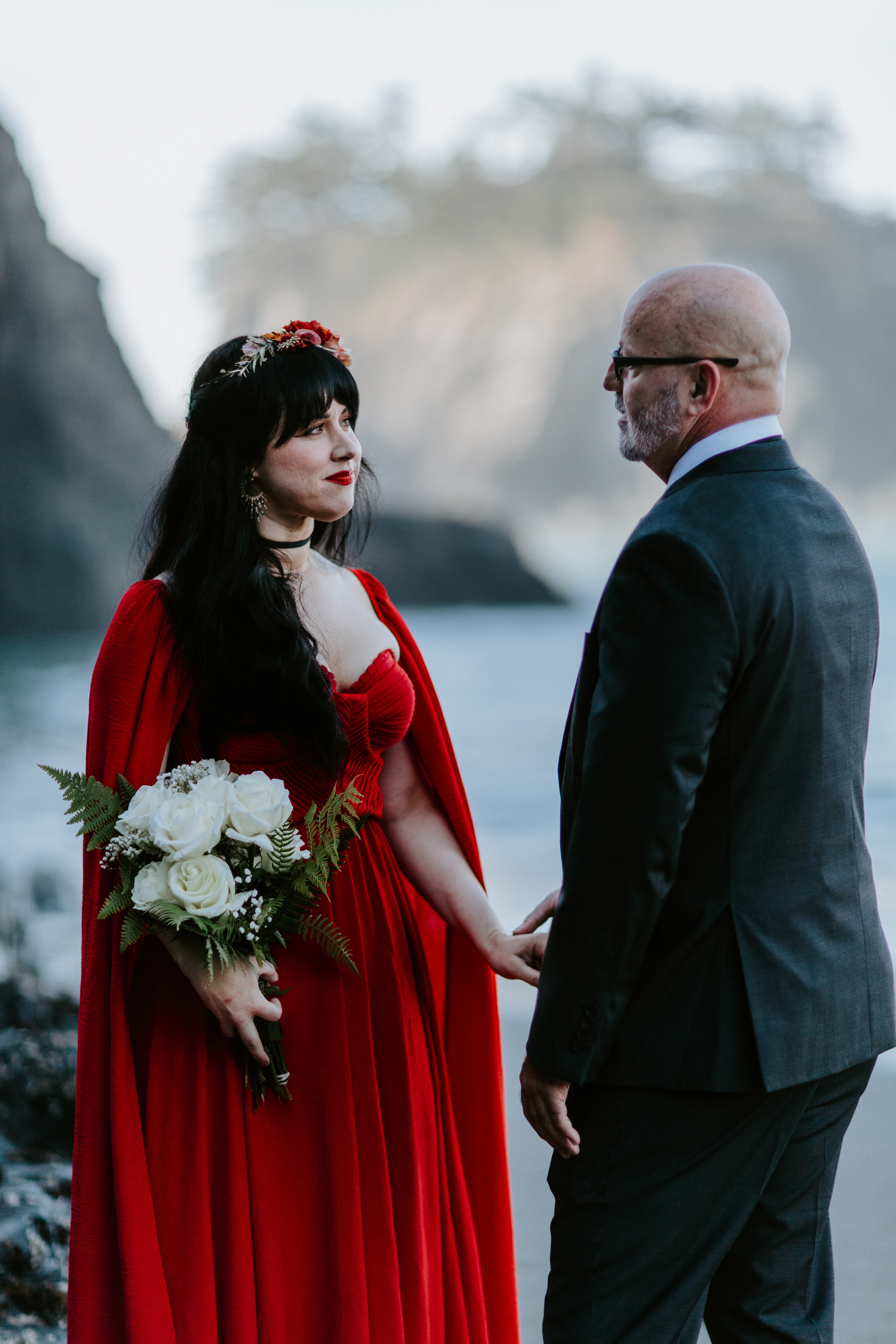 Boyd and Rachael stand hand in hand together on Secret Beach before their elopement in Samuel H. Boardman in Southern Oregon.
