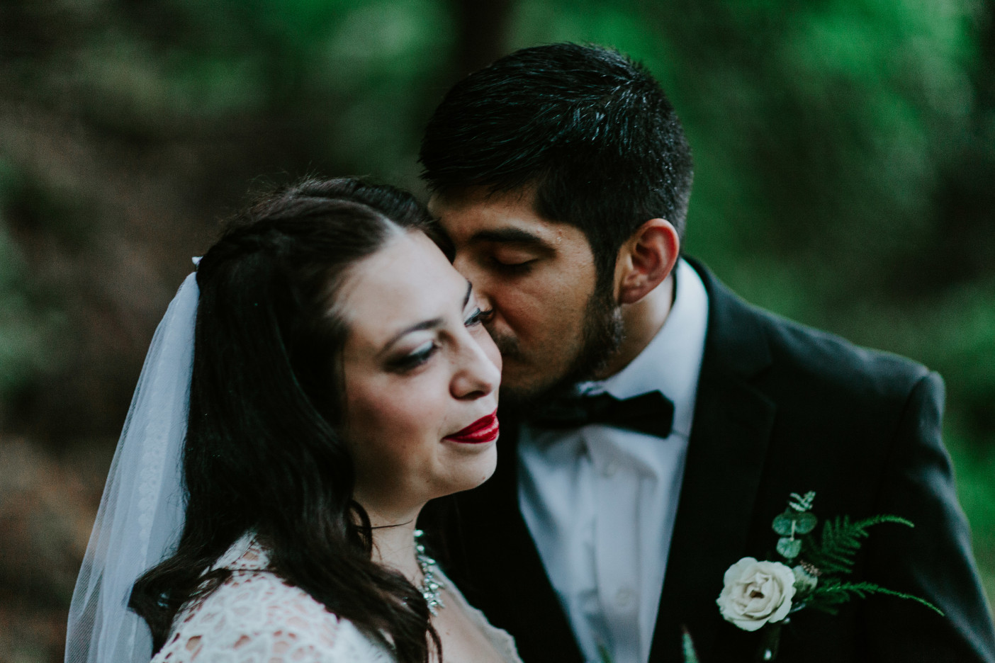 Sam kisses Sarah on the cheek at Skamania House, Washington during their Oregon Adventure. Elopement photography in Portland Oregon by Sienna Plus Josh.