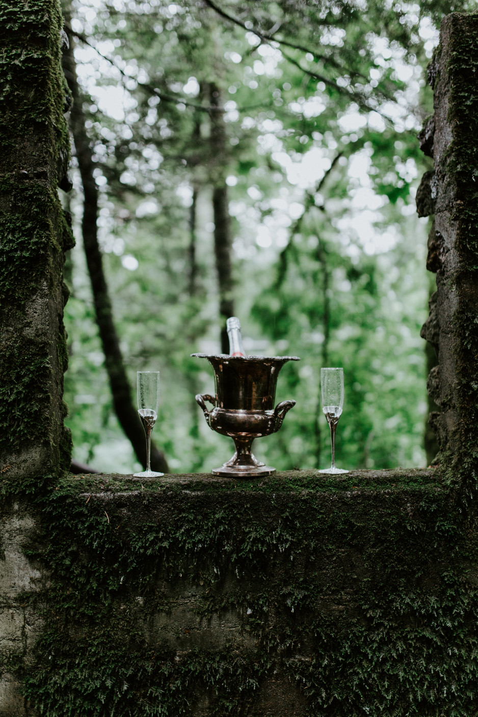 A bottle of champagne and two candles at Skamania House, Washington. Elopement photography in Portland Oregon by Sienna Plus Josh.