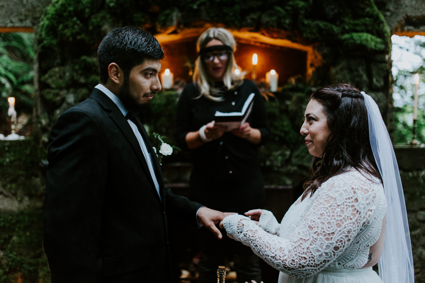 Sarah puts a ring on Sam's finger at the Columbia River Gorge in Oregon. Elopement photography in Portland Oregon by Sienna Plus Josh.