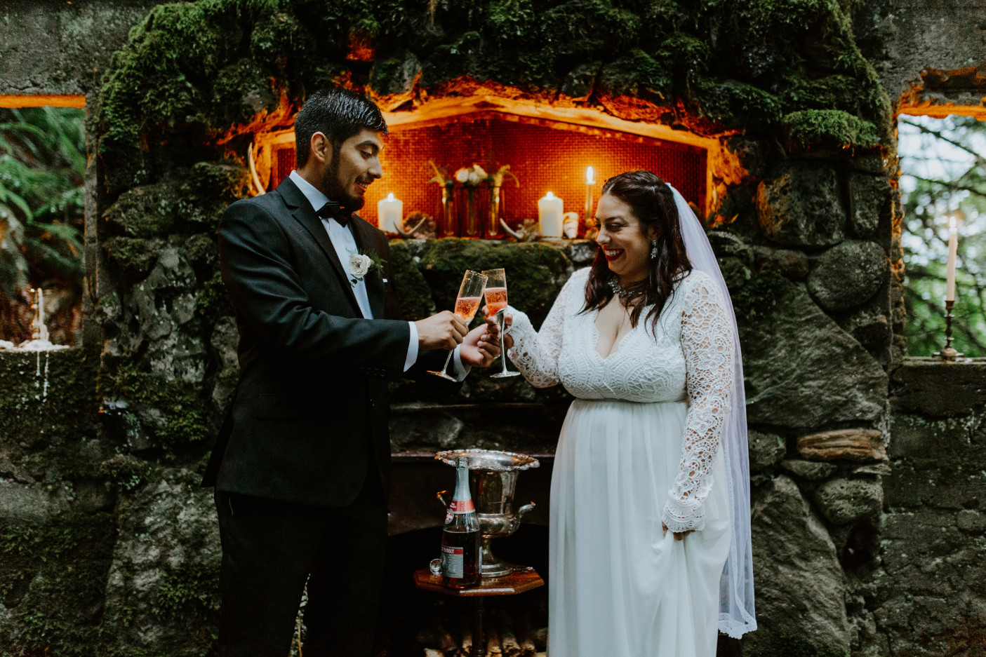 Sarah and Sam cheering with glasses of champagne at Skamania House, Washington. Elopement photography in Portland Oregon by Sienna Plus Josh.