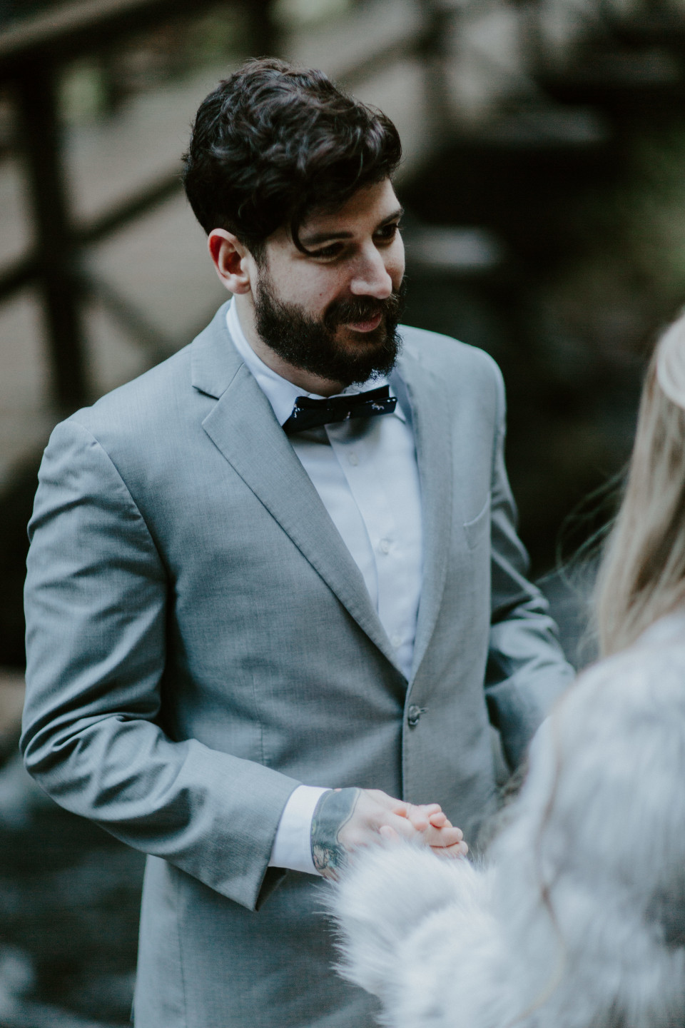 Tyanna and Boris stand in front of Latourell Falls, OR. Adventure elopement in the Columbia River Gorge by Sienna Plus Josh.