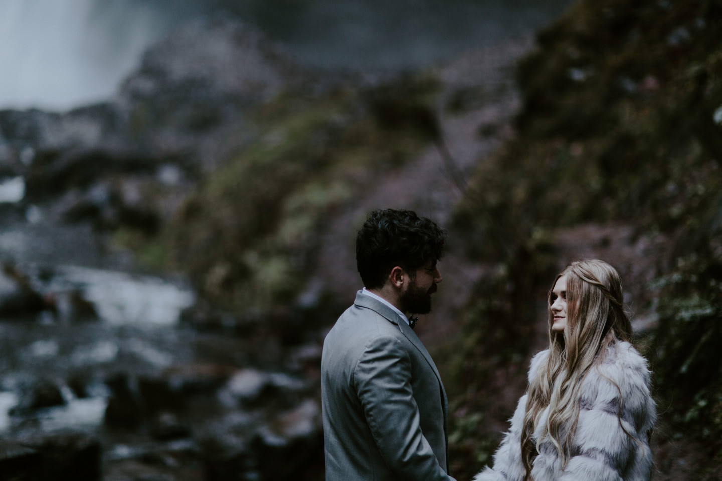 Boris and Tyanna during their elopement ceremony at Latourell Falls, OR. Adventure elopement in the Columbia River Gorge by Sienna Plus Josh.