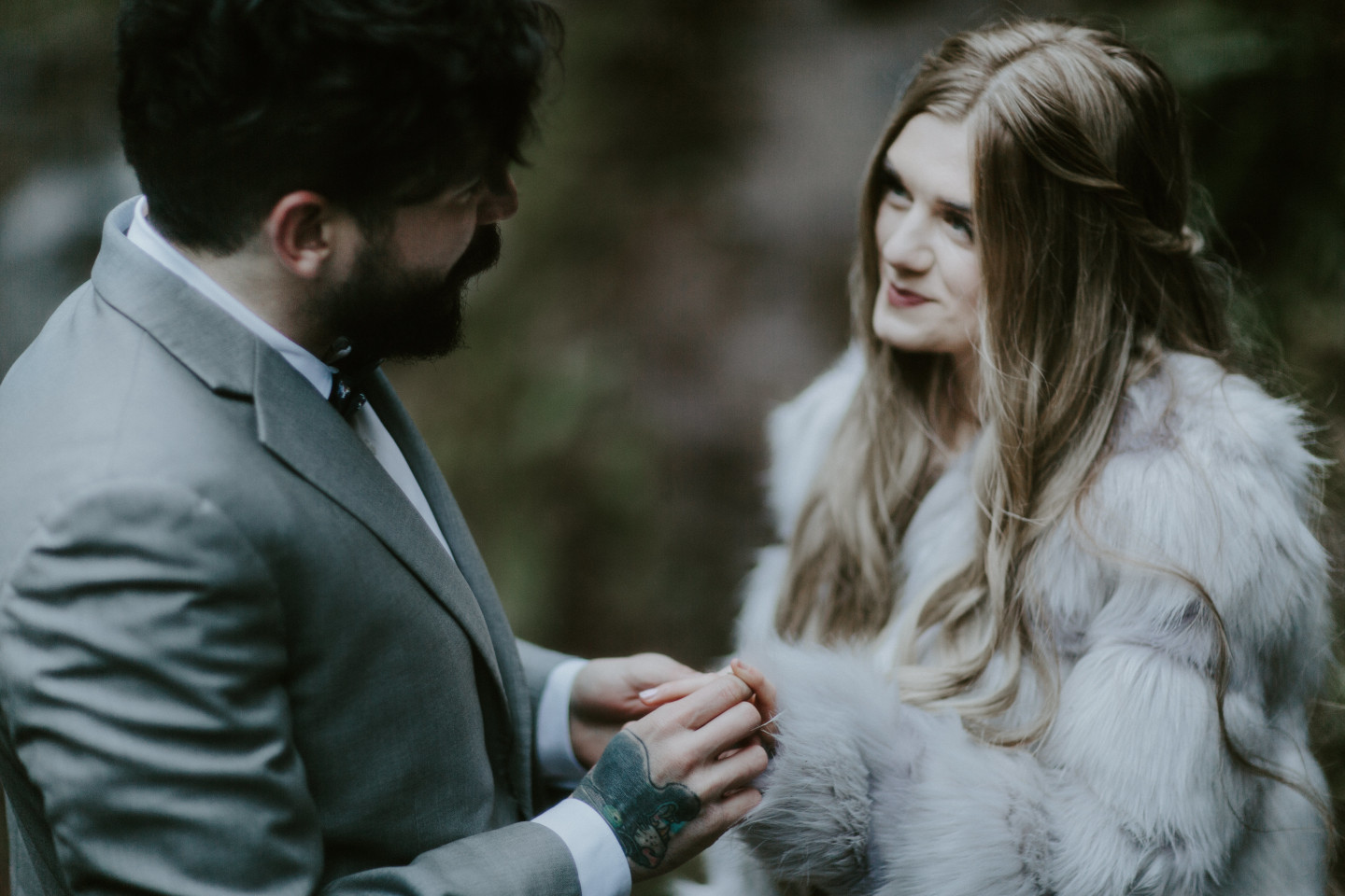 Boris reciting vows to Tyanna during their elopement ceremony in Latourell Falls, OR. Adventure elopement in the Columbia River Gorge by Sienna Plus Josh.