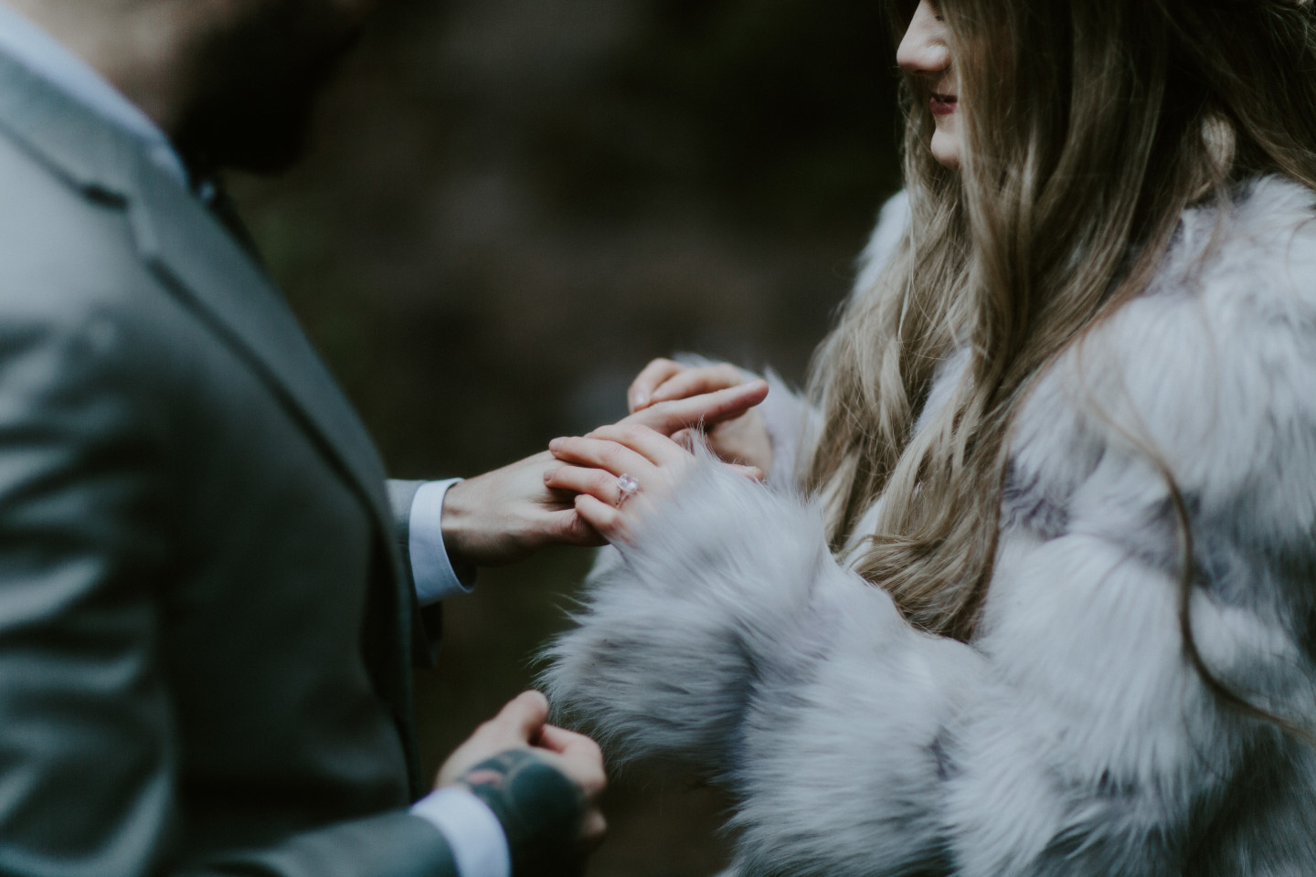 A close up of Tyanna putting a ring on Boris finger. Adventure elopement in the Columbia River Gorge by Sienna Plus Josh.