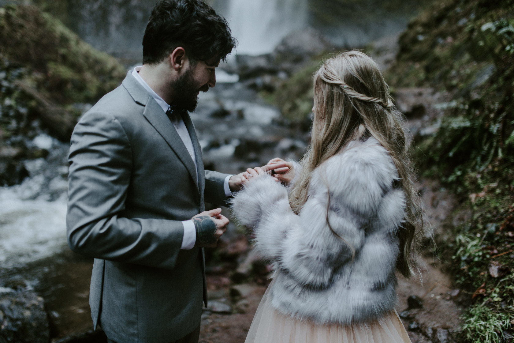Tyanna puts a ring on Boris finger at Latourell Falls, OR. Adventure elopement in the Columbia River Gorge by Sienna Plus Josh.