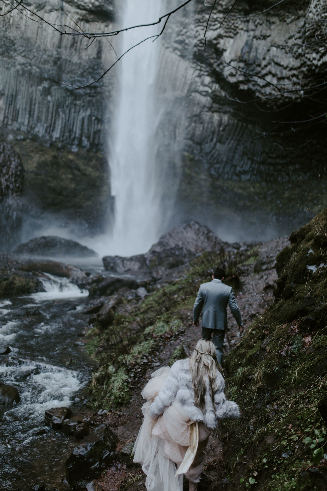 Boris lead Tyanna toward Latourell Falls, OR. Adventure elopement in the Columbia River Gorge by Sienna Plus Josh.