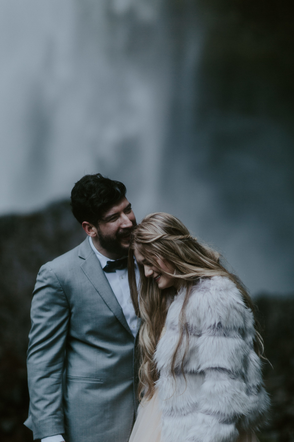 Boris and Tyanna smile at Latourell Falls, OR. Adventure elopement in the Columbia River Gorge by Sienna Plus Josh.