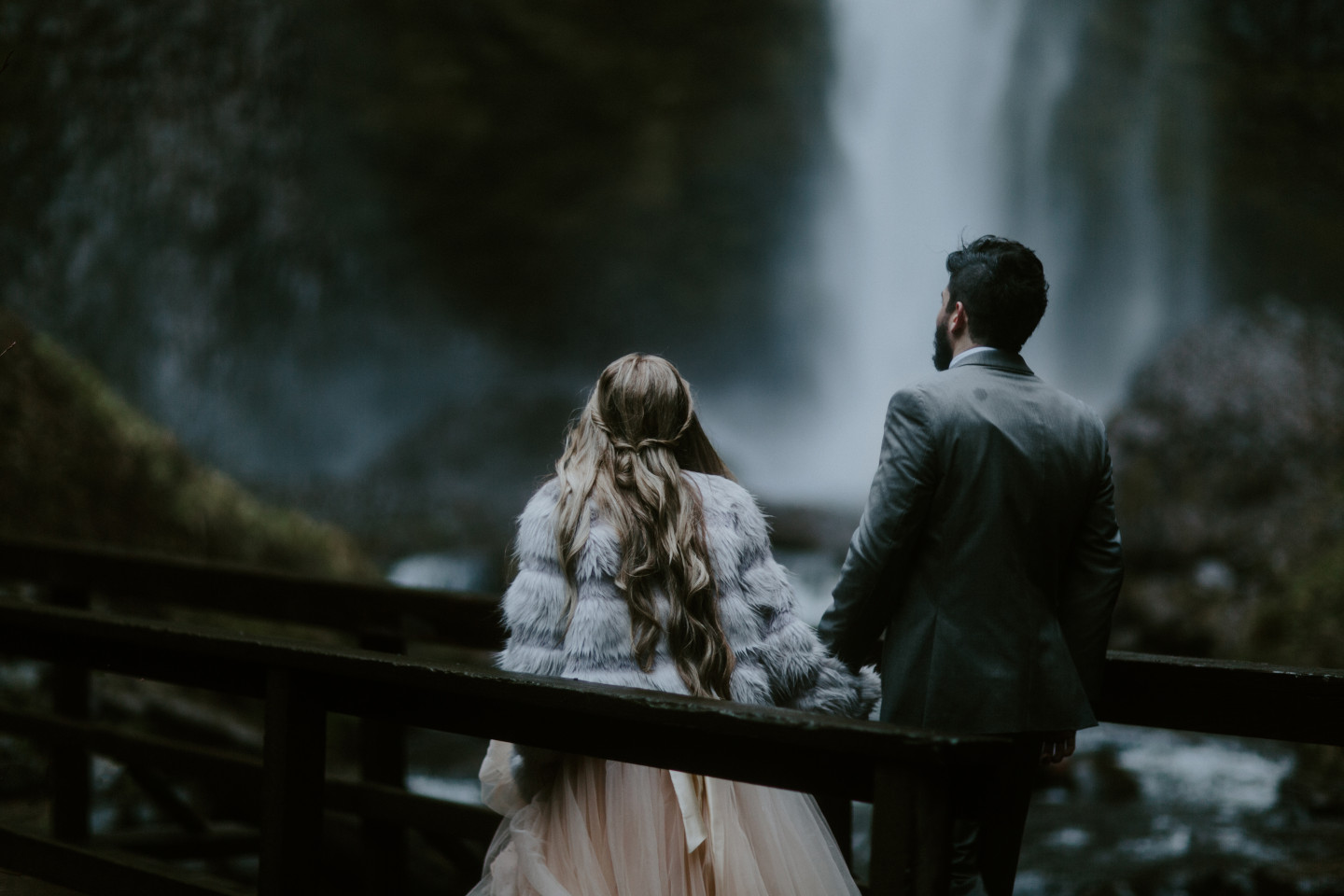 Tyanna and Boris cross a bridge at Latourell Falls, OR. Adventure elopement in the Columbia River Gorge by Sienna Plus Josh.