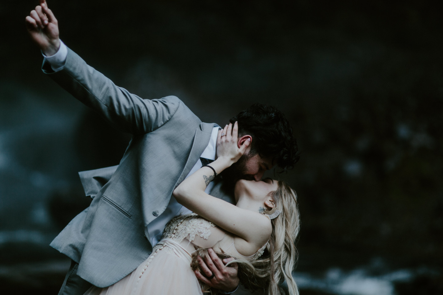 Tyanna and Boris kiss while dipping. Adventure elopement in the Columbia River Gorge by Sienna Plus Josh.