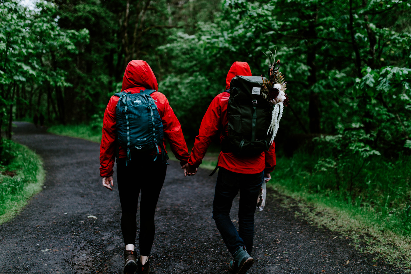 Jordan and Andrew walk the trail to Wahcella Falls for their elopmeent ceremony.