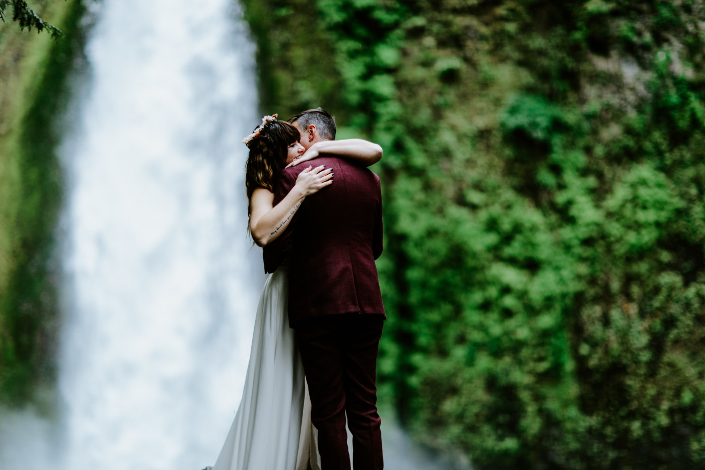 Jordan hugs Andrew in front of Wahcella Falls.