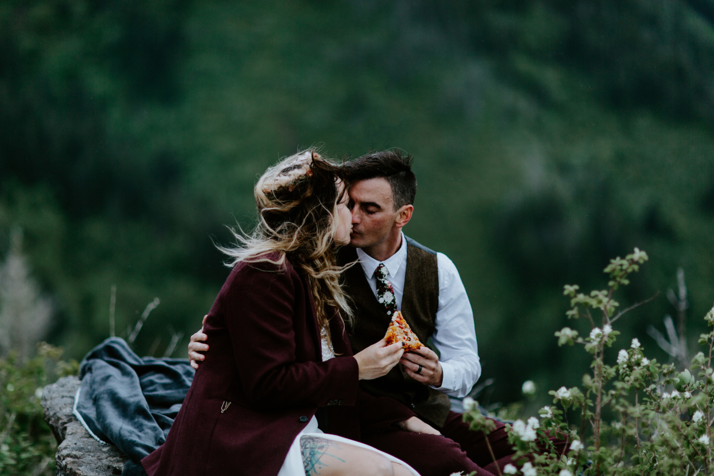 Jordan and Andrew kiss while sitting on top of Angels Rest in the Columbia River Gorge.